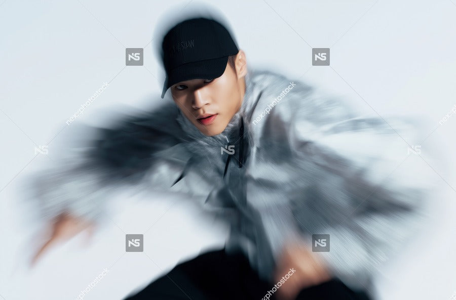 Man In Camouflage Jacket Mid Action Pose Black And White Background Top View Neutral Lighting — Stock Photo